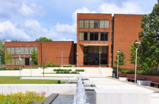 Dark red brick exterior of the Parlett Moore Library on the campus of Coppin State University